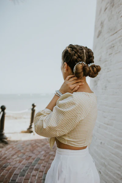 Playful space buns hairstyle for a casual date night