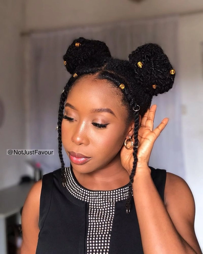 Playful space buns styled for a casual date night, with loose strands framing the face
