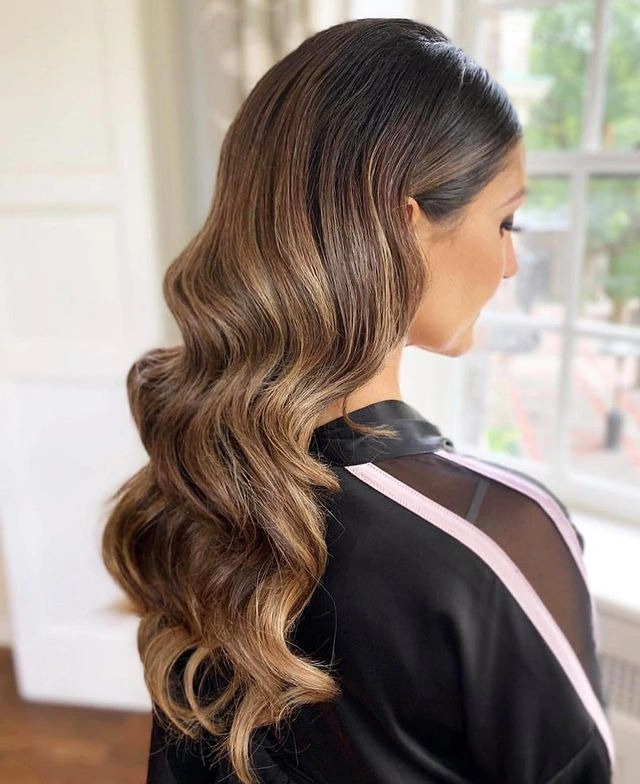 Quick fix date night hair for post work evenings - a woman styling an elegant yet simple updo