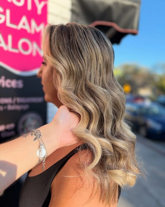 Romantic balayage hairstyle for a date night, soft waves and warm highlights