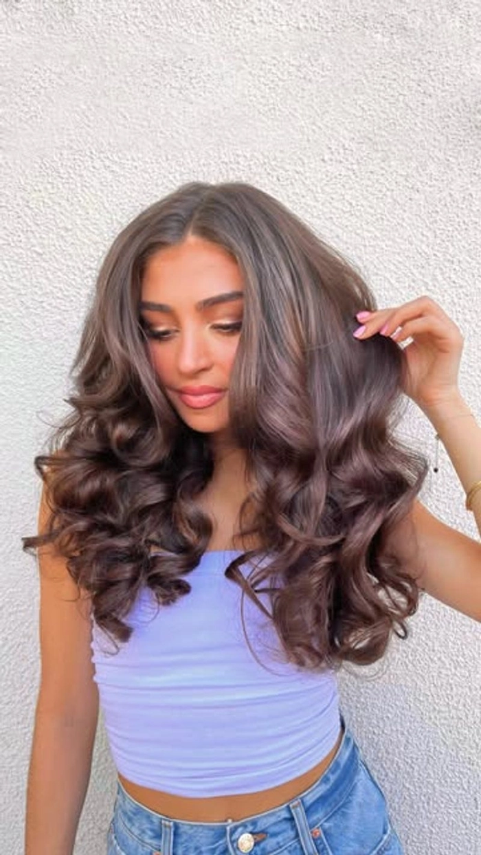Medium length romantic curls styled for an evening date night look