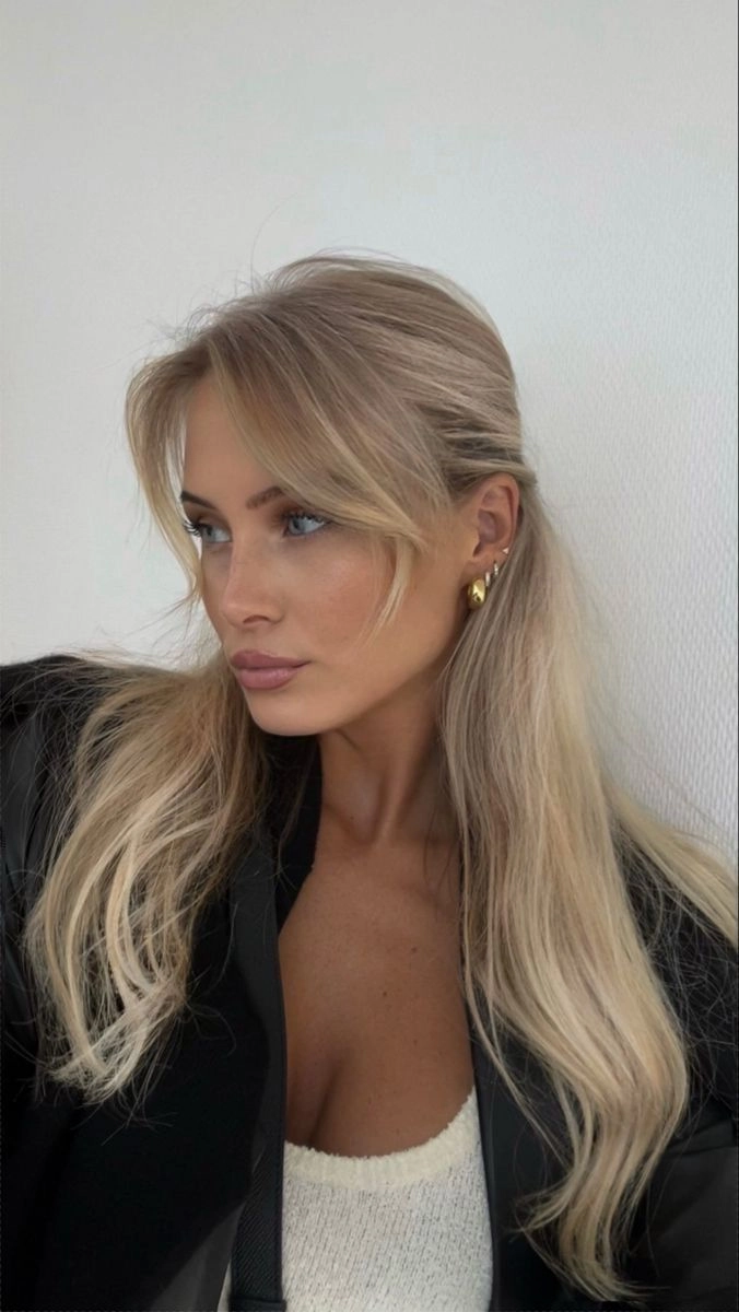 Romantic evening hairstyle with soft curtain bangs for a date night look