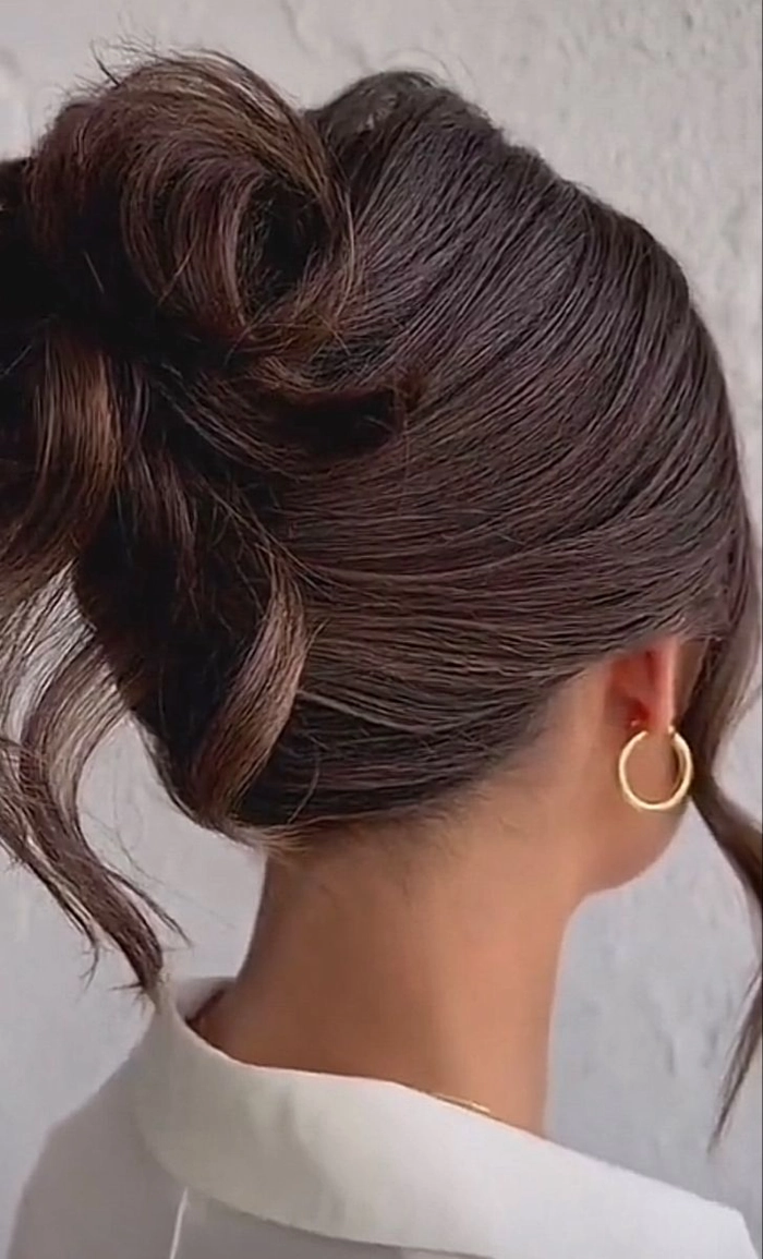 Classic updo with twisted details perfect for a sophisticated evening out Elegant romantic French twist hairstyle for a formal date night