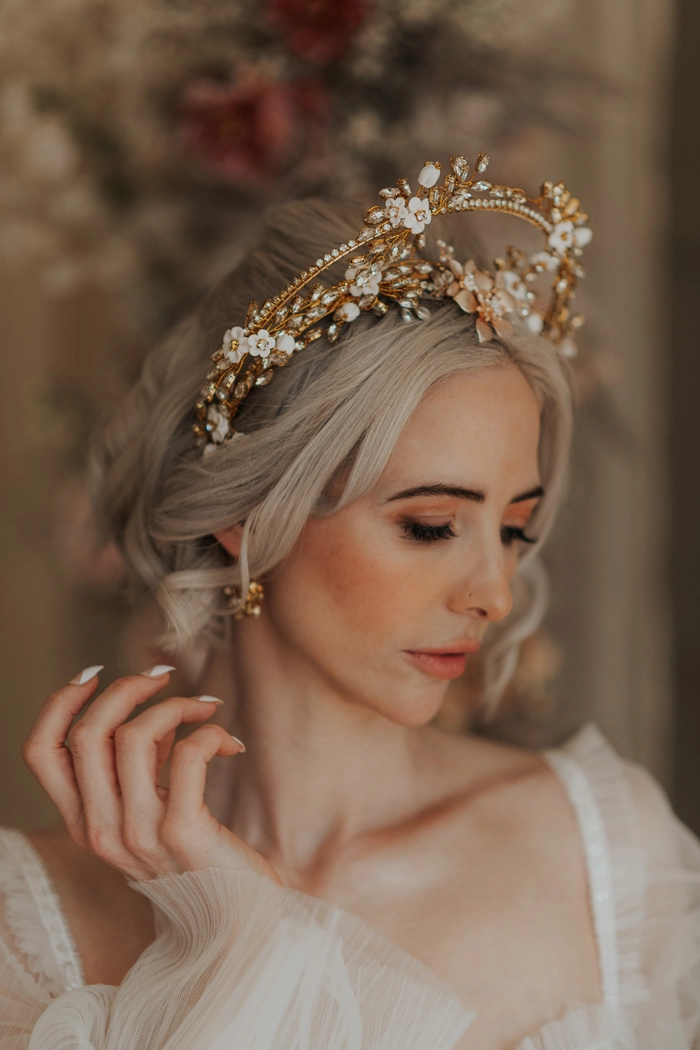 Romantic updo with delicate lace hairpin and soft waves for date night