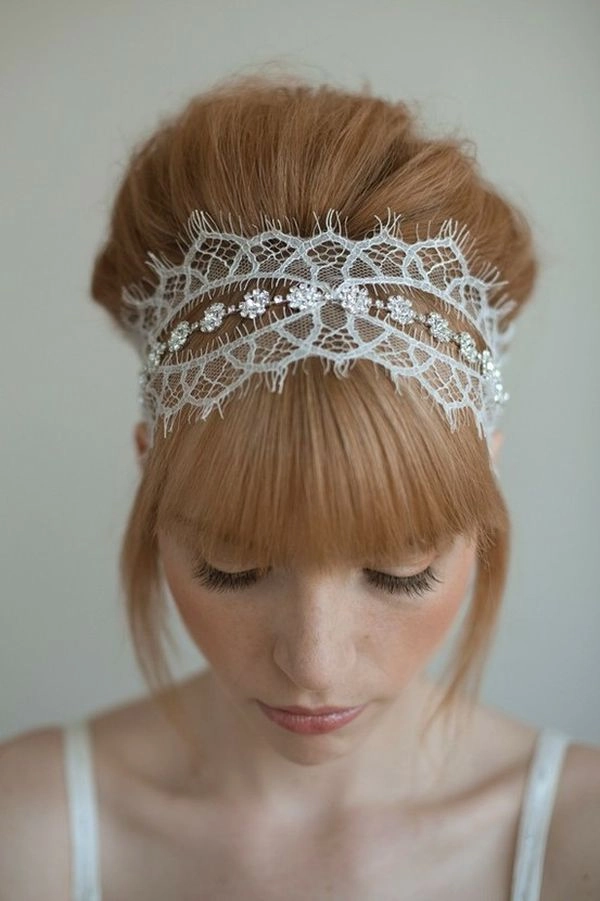 Romantic date night hairstyle featuring a delicate lace hair accessory