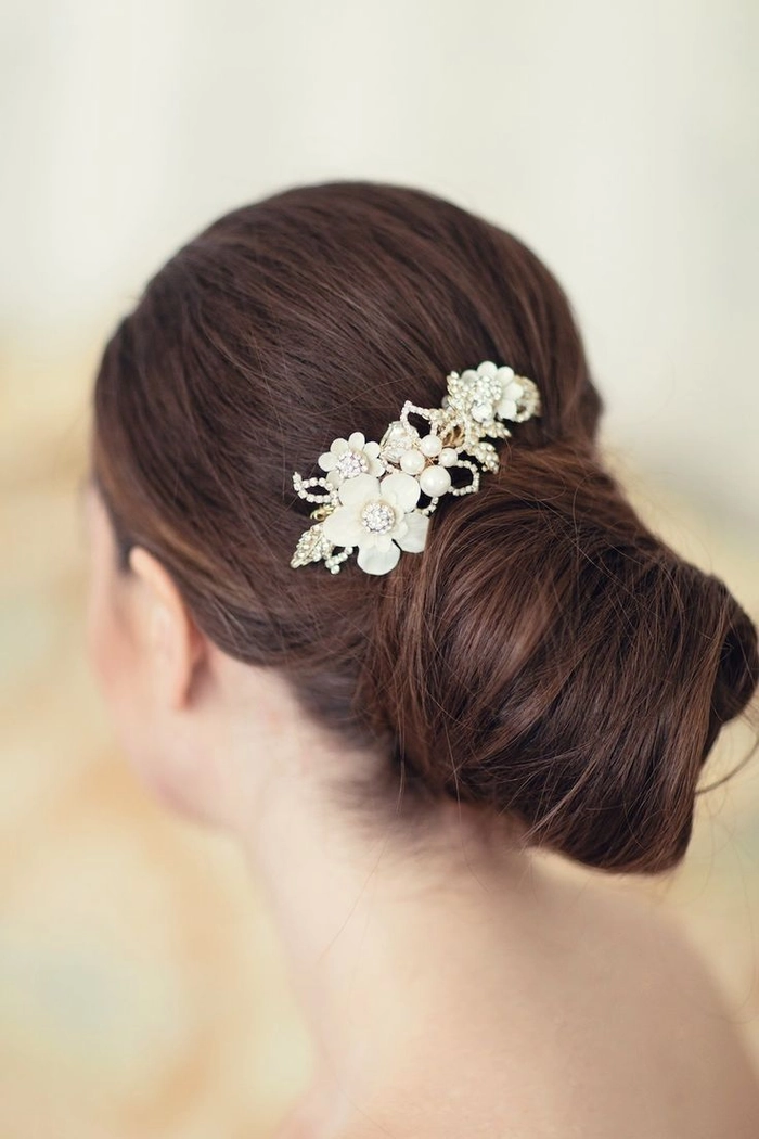 Romantic date night updo featuring a delicate lace hair accessory