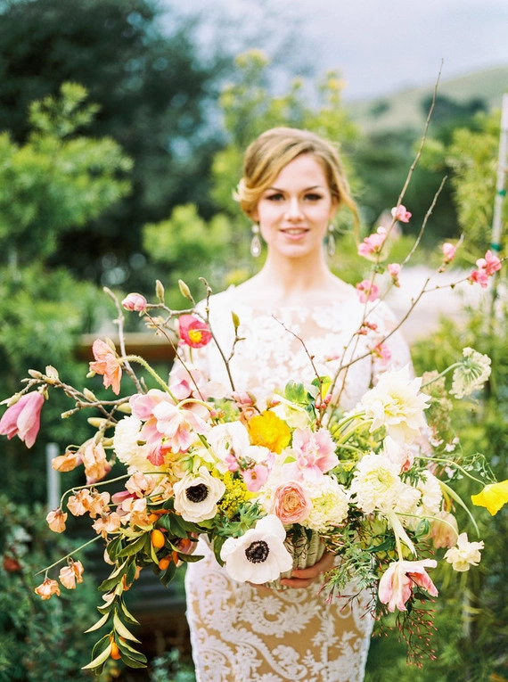 Romantic spring garden dinner hairstyle with soft waves and floral accents