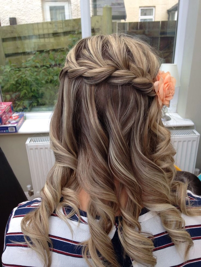Elegant spring date waterfall braid hairstyle with floral accents Romantic waterfall braids for a spring date night