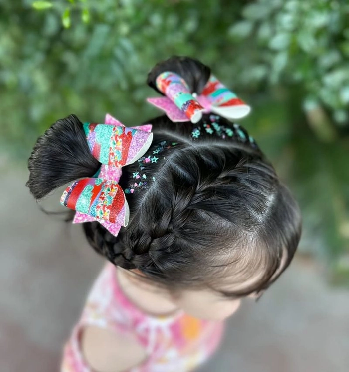 Elegant date night hair with silk ribbon-wrapped buns Sleek buns wrapped with silk ribbons for a romantic date night hairstyle