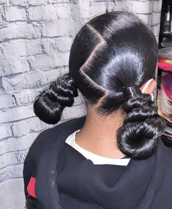 Romantic date night hairstyle featuring a smooth bun and silk ribbon wrap Sleek bun tied with a silk ribbon for an elegant date night look