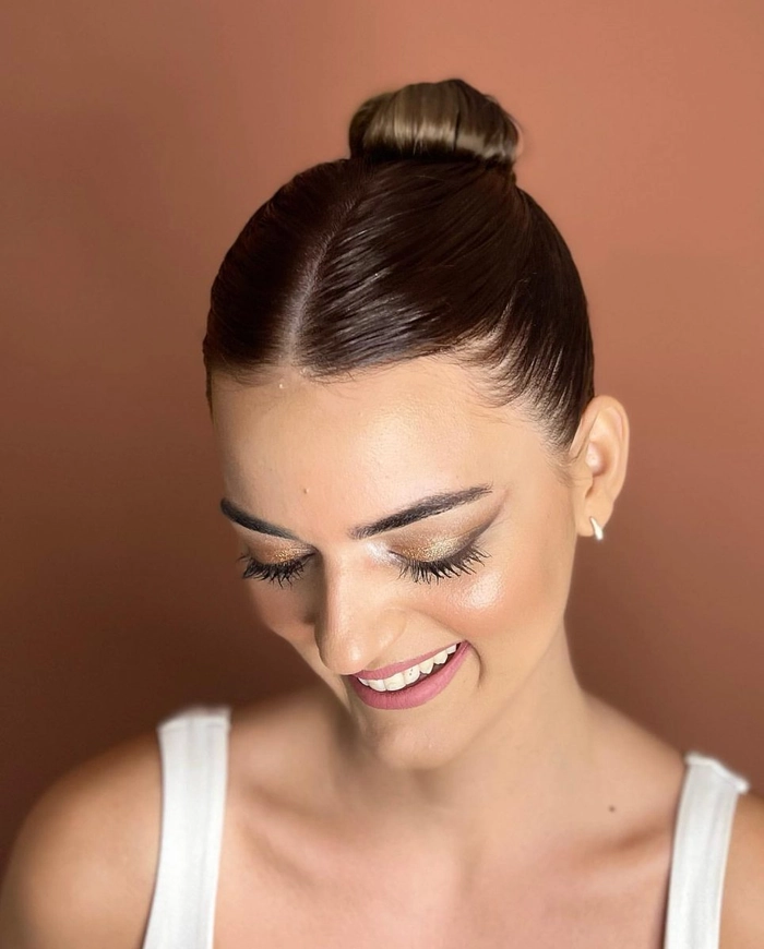 Sleek Bun with Silk Ribbons - Date Night Hair Style 9 A sleek bun hairstyle wrapped with silk ribbons, perfect for a romantic date night look.