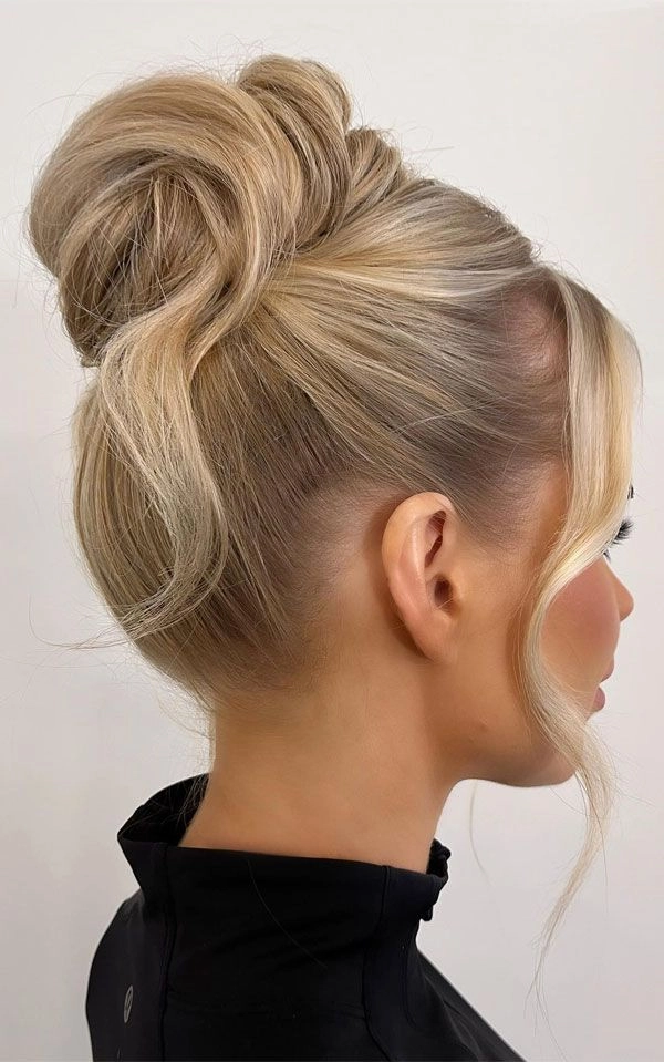 Soft Face Framing Tendrils Updo for a Romantic Evening An elegant updo adorned with soft tendrils framing the face, ideal for a date night hairstyle