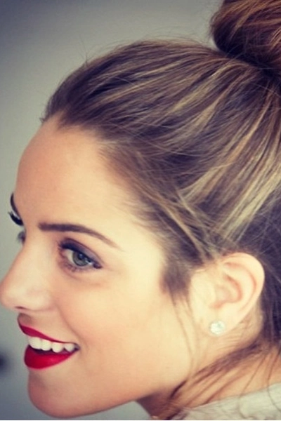 Chic top knot with refined styling perfect for formal evening occasions Elegant sophisticated top knot hairstyle for an evening date night event