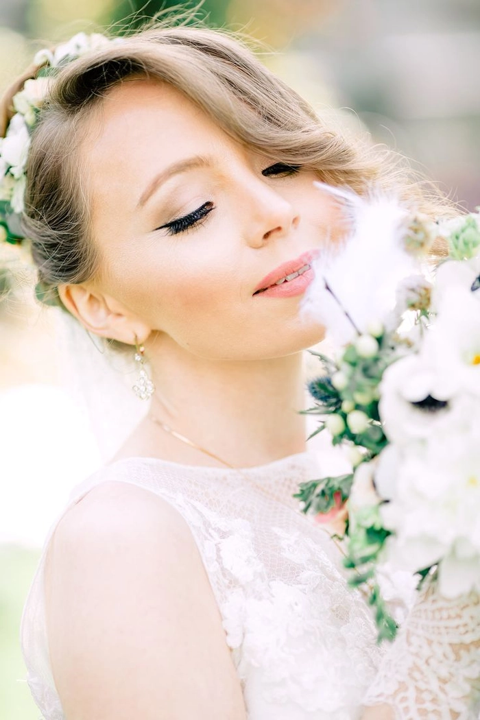 Romantic spring garden dinner hairstyle with soft waves and floral accents