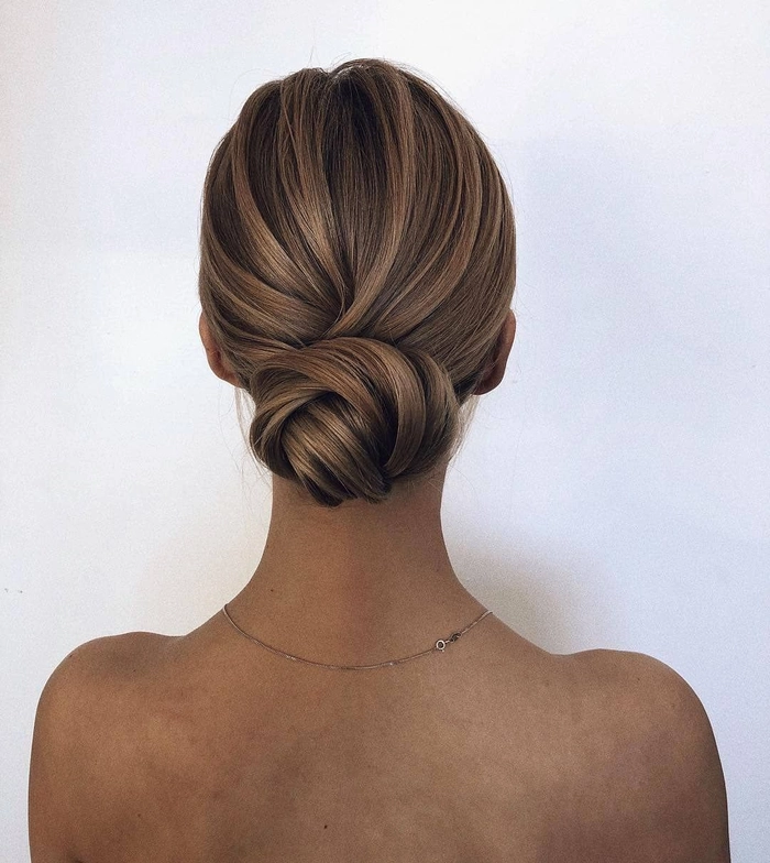 Elegant straight hair bun for a romantic date night look