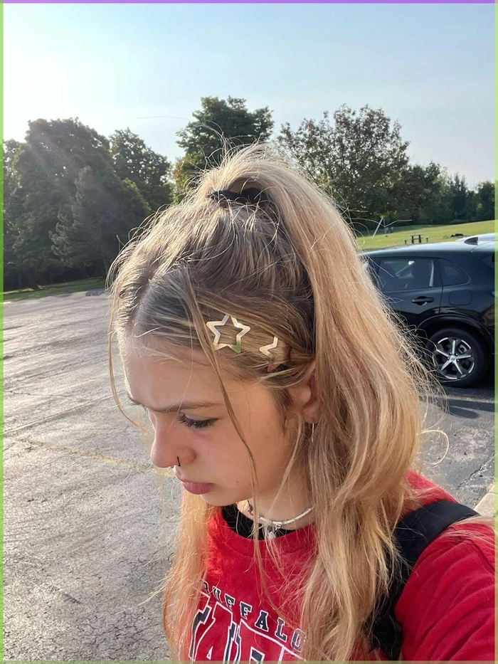 Summer Concert Date Braided Crown Updo Hairstyle Woman with a braided crown updo at a sunlit outdoor concert