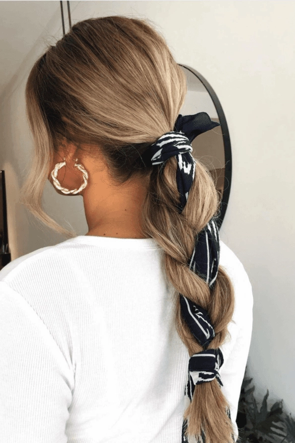 Active couple enjoying a sweat proof date night hairstyle while biking at sunset