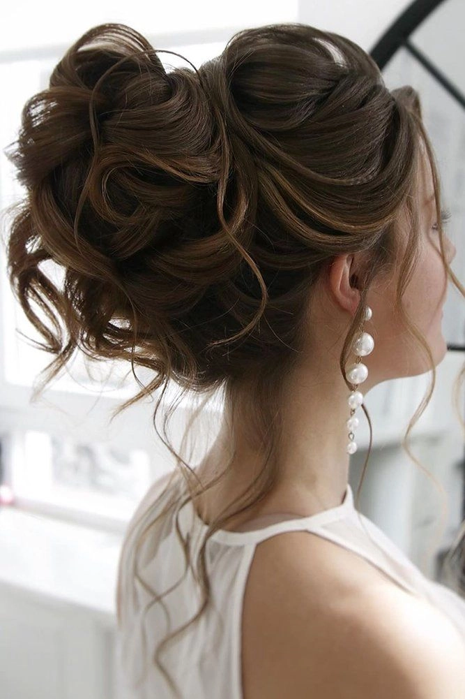 Tenth anniversary date night hairstyle featuring romantic curls and pearl accents Elegant updo with soft waves for a tenth anniversary date night look