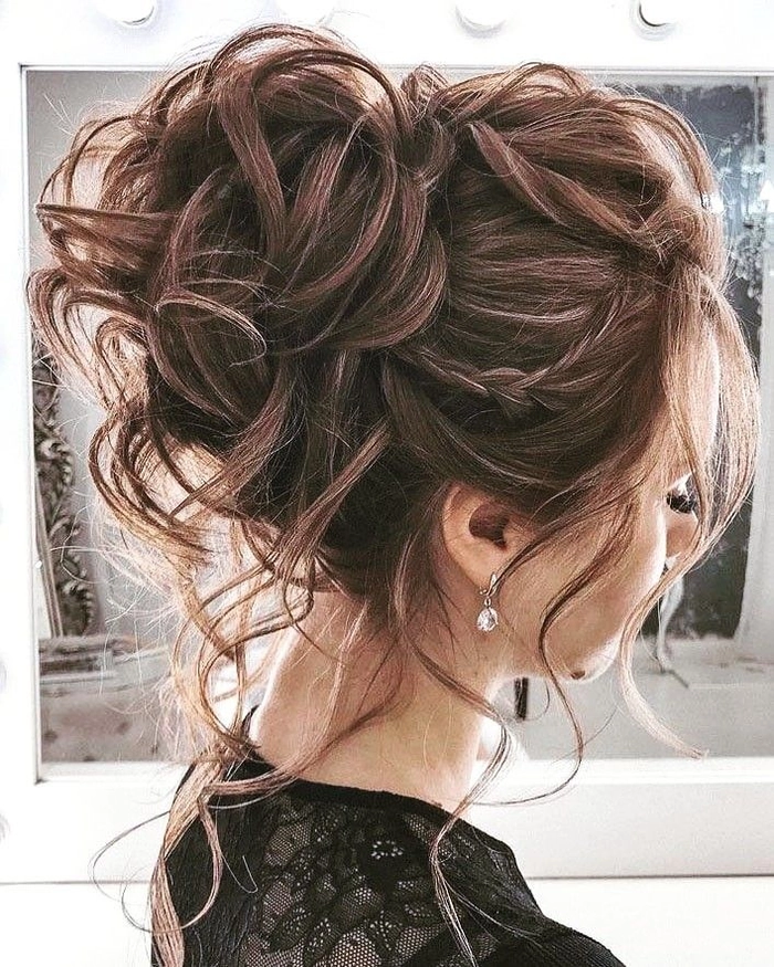 Sophisticated date night hairstyle for a milestone celebration Elegant tenth anniversary updo with soft waves and subtle sparkle