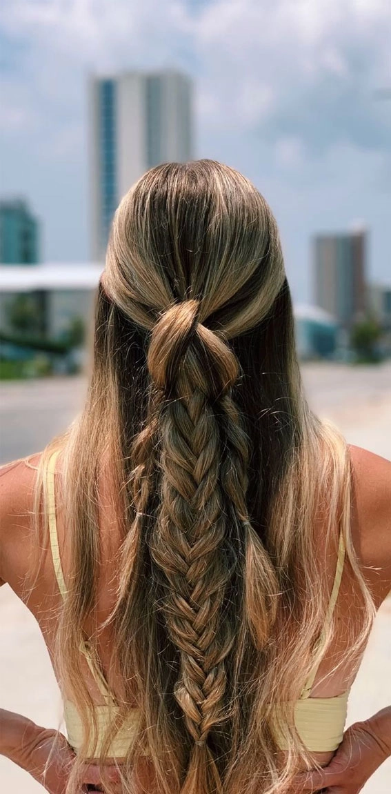 Festival hairstyles for beach parties with braids and seashell accents