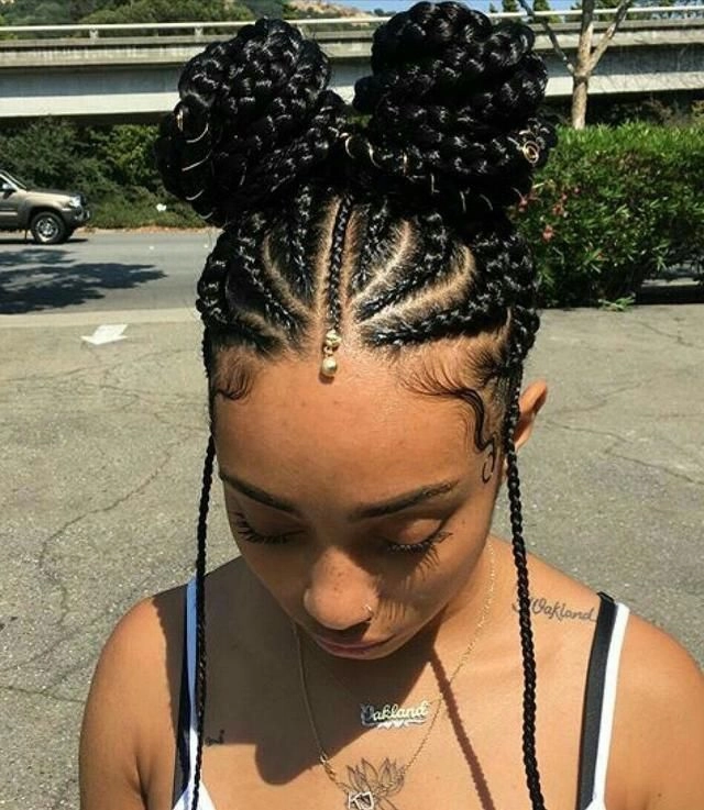 Creative Bonnaroo hairstyle inspiration for music festival goers Bonnaroo festival hairstyle with messy top knot and floral crown