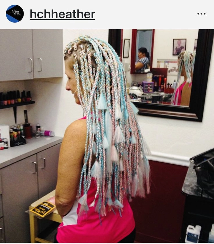 Festival hairstyle featuring braided coils and metallic accents at Burning Man Burning Man festival hairstyle with braided coils and silver accessories