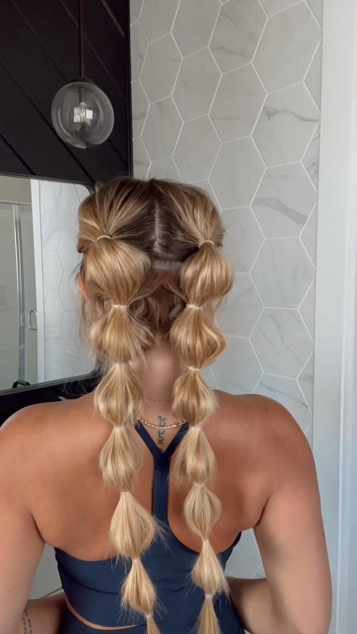 Young woman with braided updo and floral headband at a camping festival