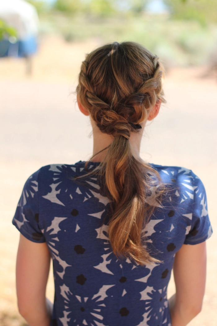 Camping festival hairstyle with braids and flowers for an outdoor concert look