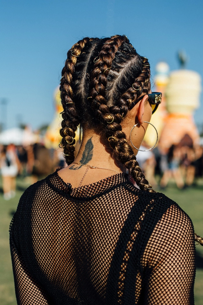 Coachella festival hairstyle with braided crown and floral accents