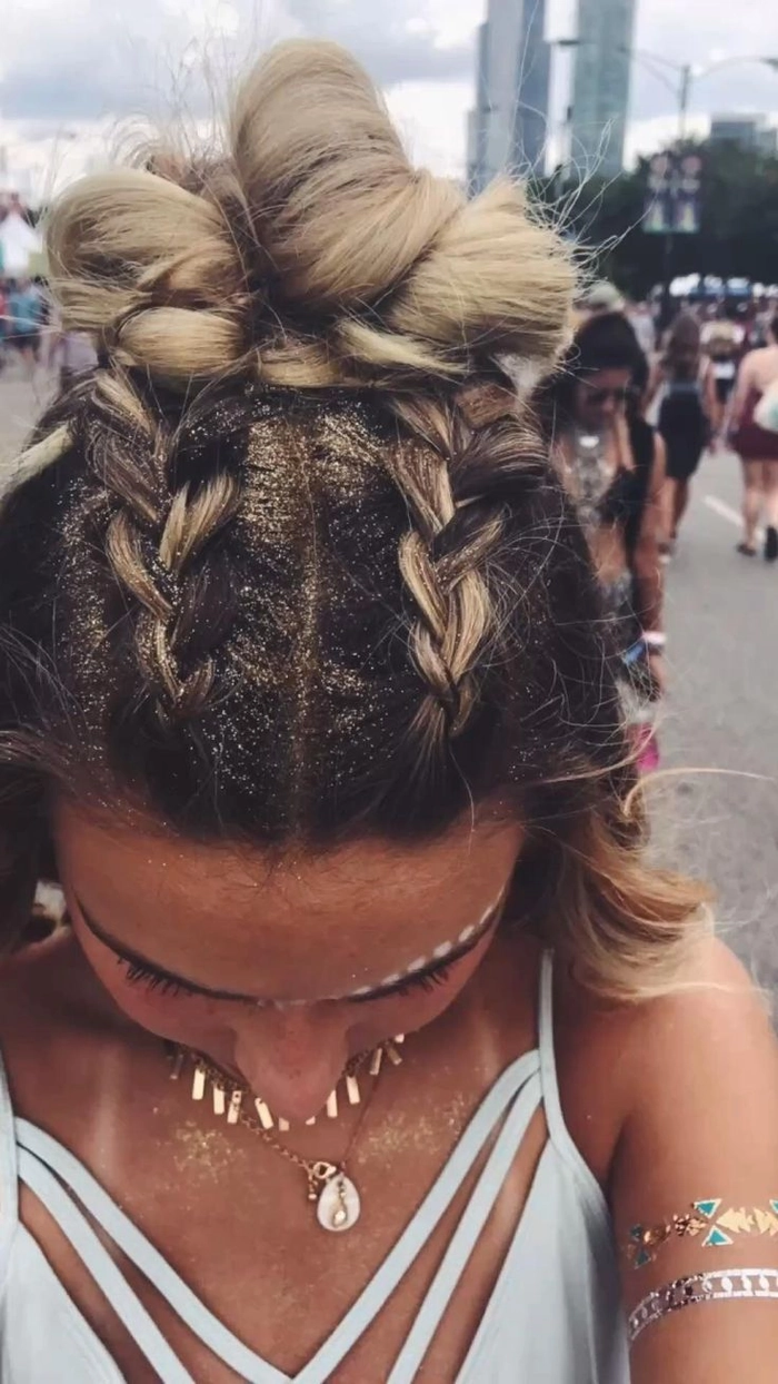 Woman with braided updo and floral crown at daytime festival