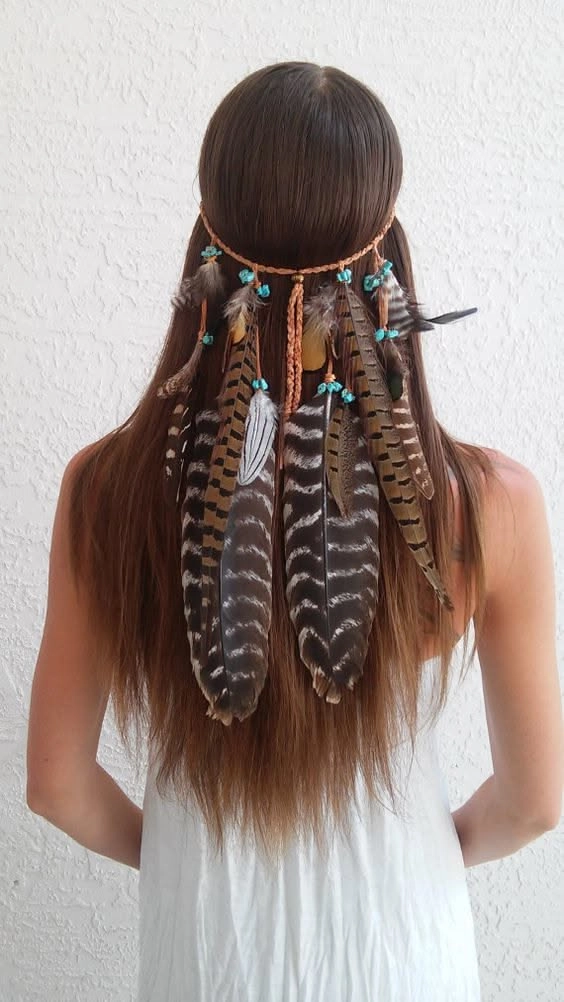 10 Easy Festival Hairstyles – Braided Crown with Flowers Woman with easy festival hairstyle featuring braided crown and floral accents