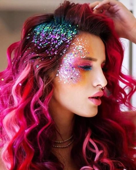 EDM festival hairstyle with colorful braids and glitter