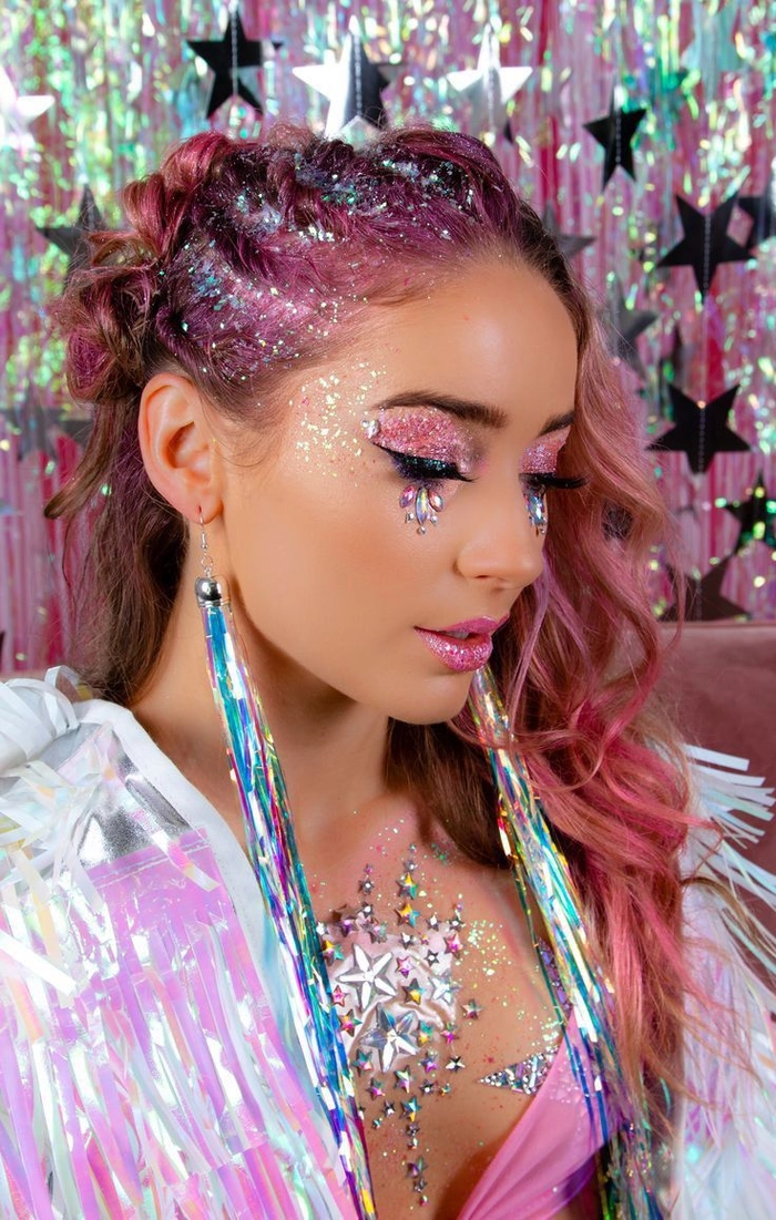 Elegant festival hairstyle with braided crown and soft waves