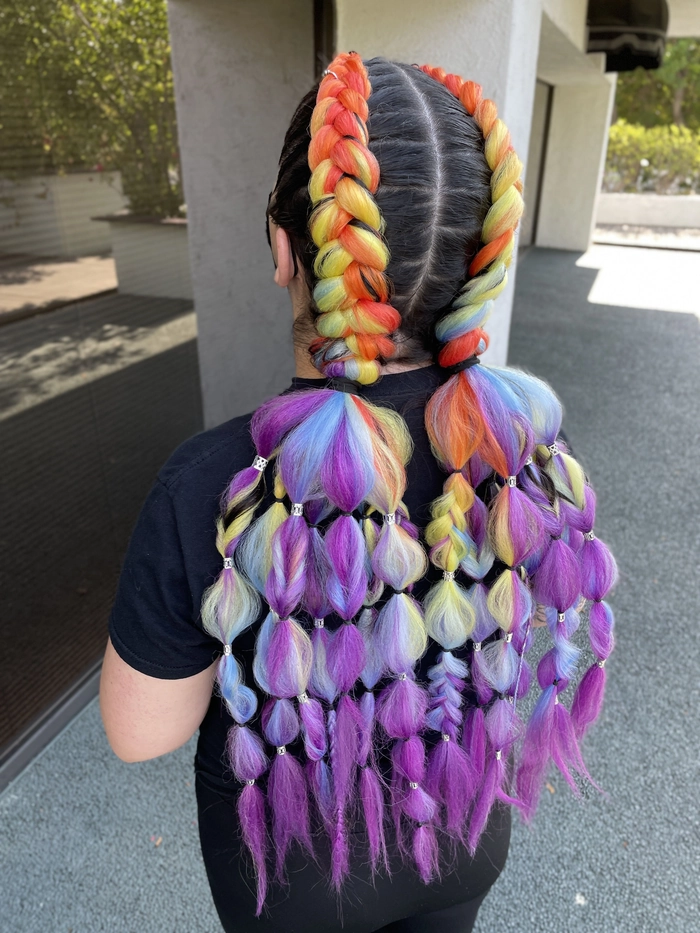 Festival braided hairstyles with colorful ribbons and beads for a fun bohemian look