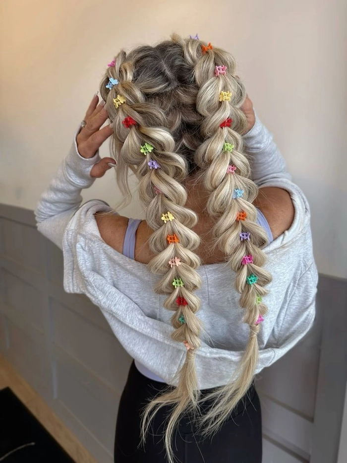 Braids and beads festival hairstyle for a boho music event Festival hairstyle with braids and beads cascading down the back