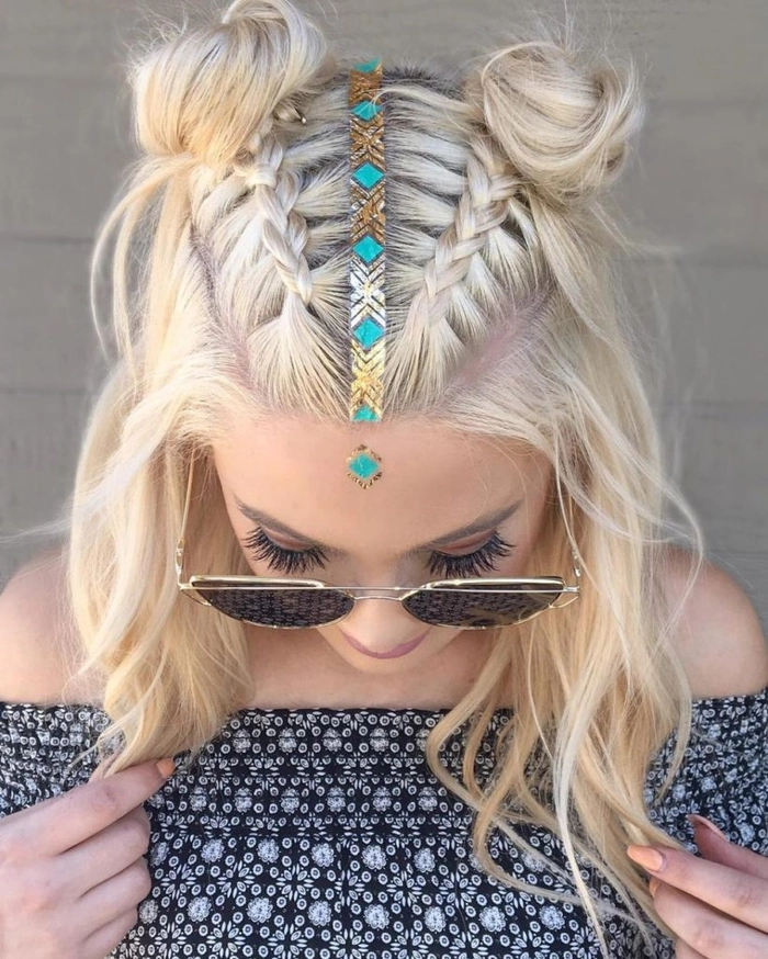 Festival bun hairstyle with braided accents and floral accessories for a bohemian vibe