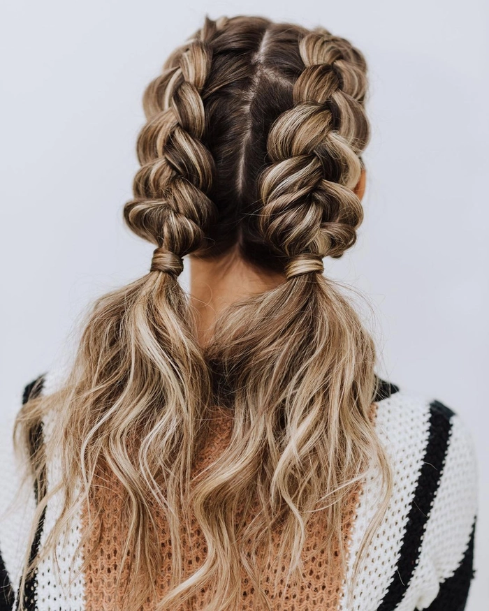 Festival Dutch braid hairstyle with flowers and glitter accents