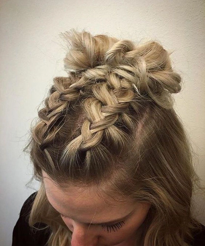 Festival Dutch braid hairstyle with textured waves and floral accents