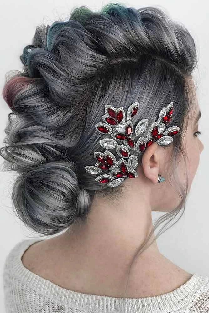 Festival Faux Hawk Hairstyle with Glitter and Floral Accents Woman with a bold faux hawk hairstyle decorated with festival glitter and flowers