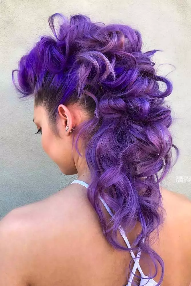 Edgy festival faux hawk braided style for summer concerts Festival faux hawk hairstyle with colorful braids and beads