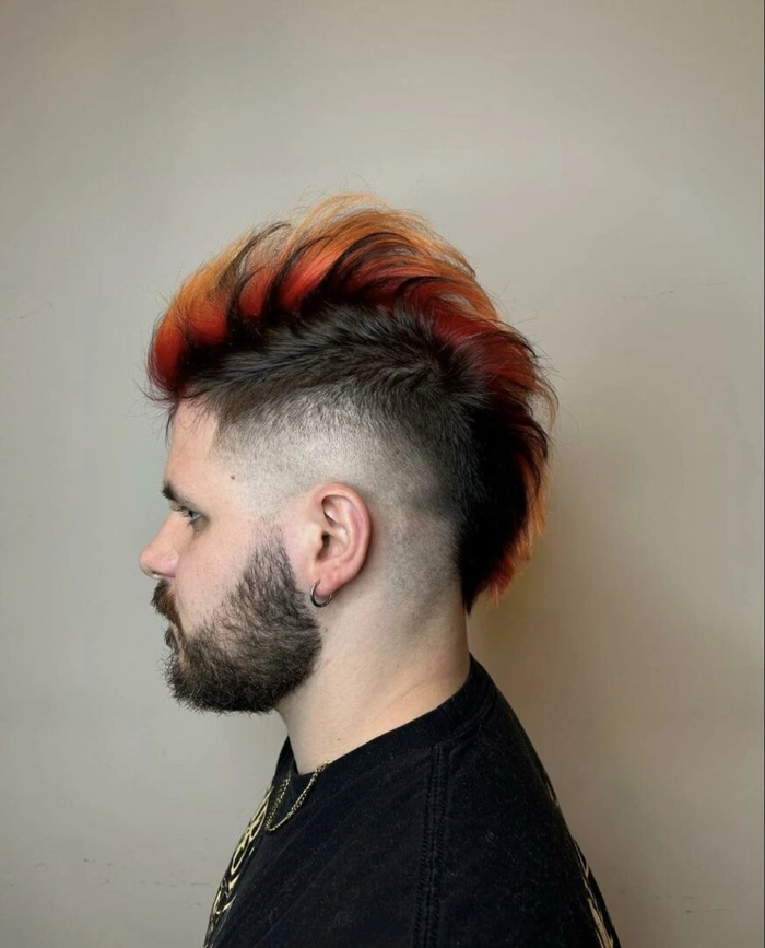 Festival Faux Hawk Hairstyle with Braids and Rainbow Extensions Festival faux hawk hairstyle with braided sides and colorful hair accessories