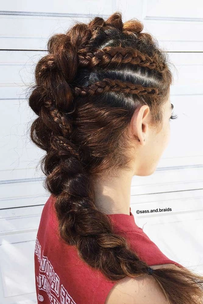 Edgy festival faux hawk with braided sides and bold highlights Festival faux hawk hairstyle with teased spikes and floral accents