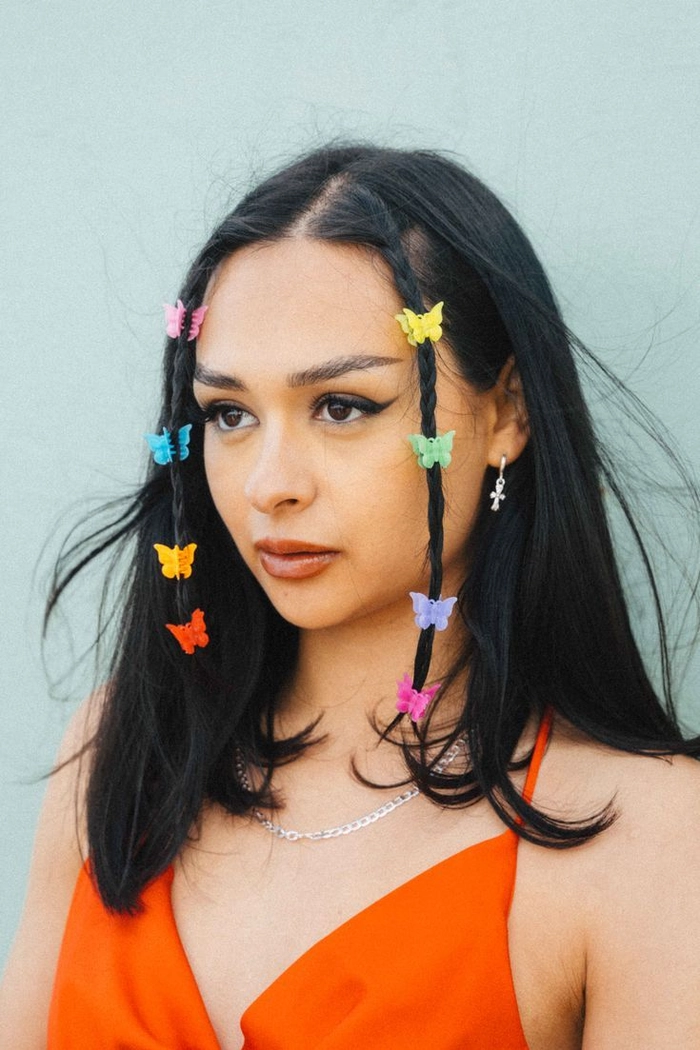 Boho butterfly clip hairstyle perfect for music festivals Festival hairstyle with colorful butterfly clips and braided accents