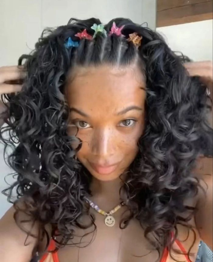Festival hairstyle with butterfly clips and loose waves Festival hairstyles with butterfly clips on a braided updo