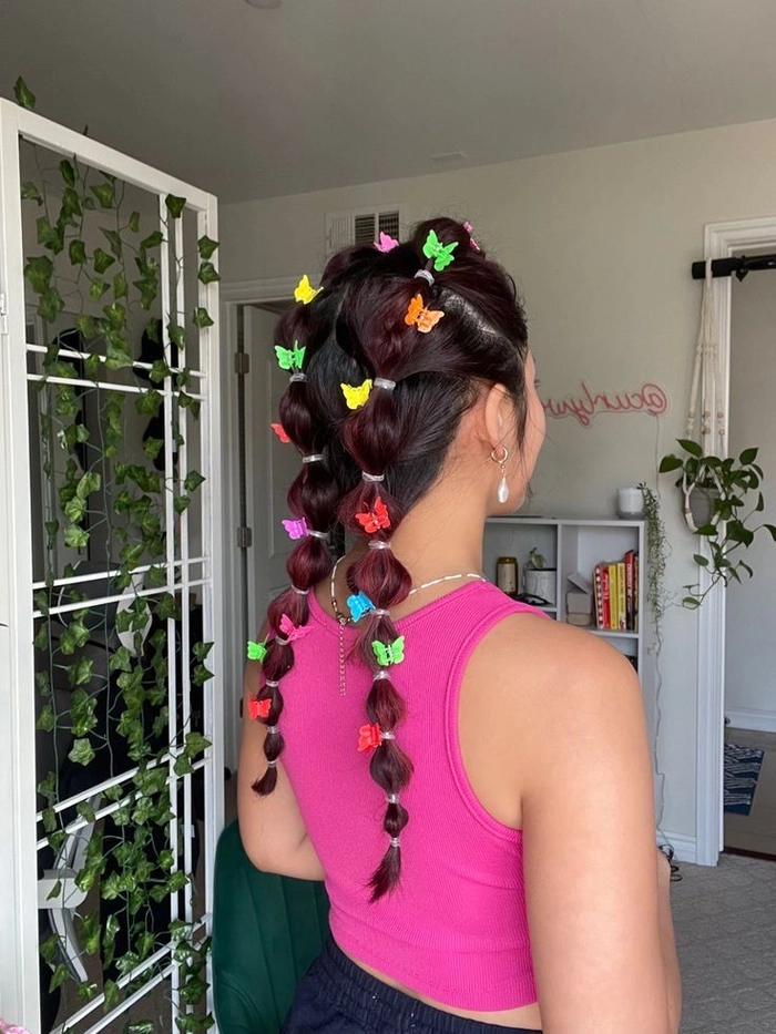 Festival Hairstyle Inspiration with Butterfly Clips - Image 10 Festival hairstyles with butterfly clips in a vibrant updo
