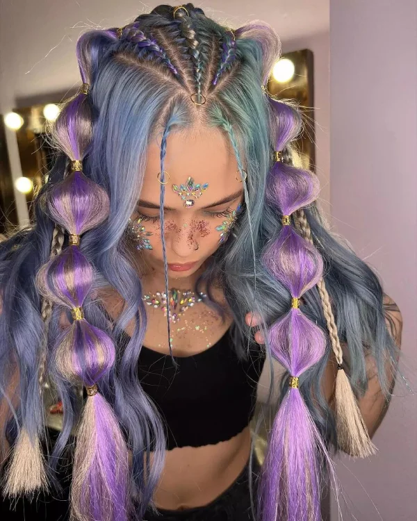 Woman showing off a festival hairstyle with vibrant colored spray accents