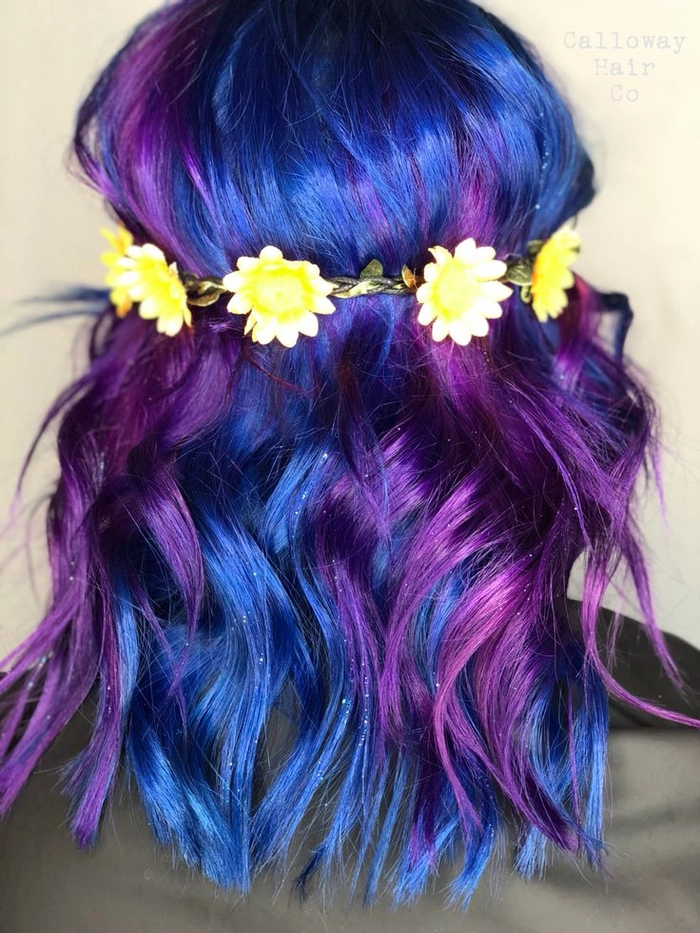 Bright festival hairstyle with vivid colored spray and braided details
