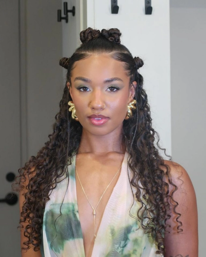Festival hairstyles for curly hair with colorful accessories and loose curls