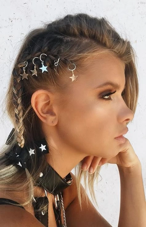 Braided festival hairstyle for long hair with floral accents