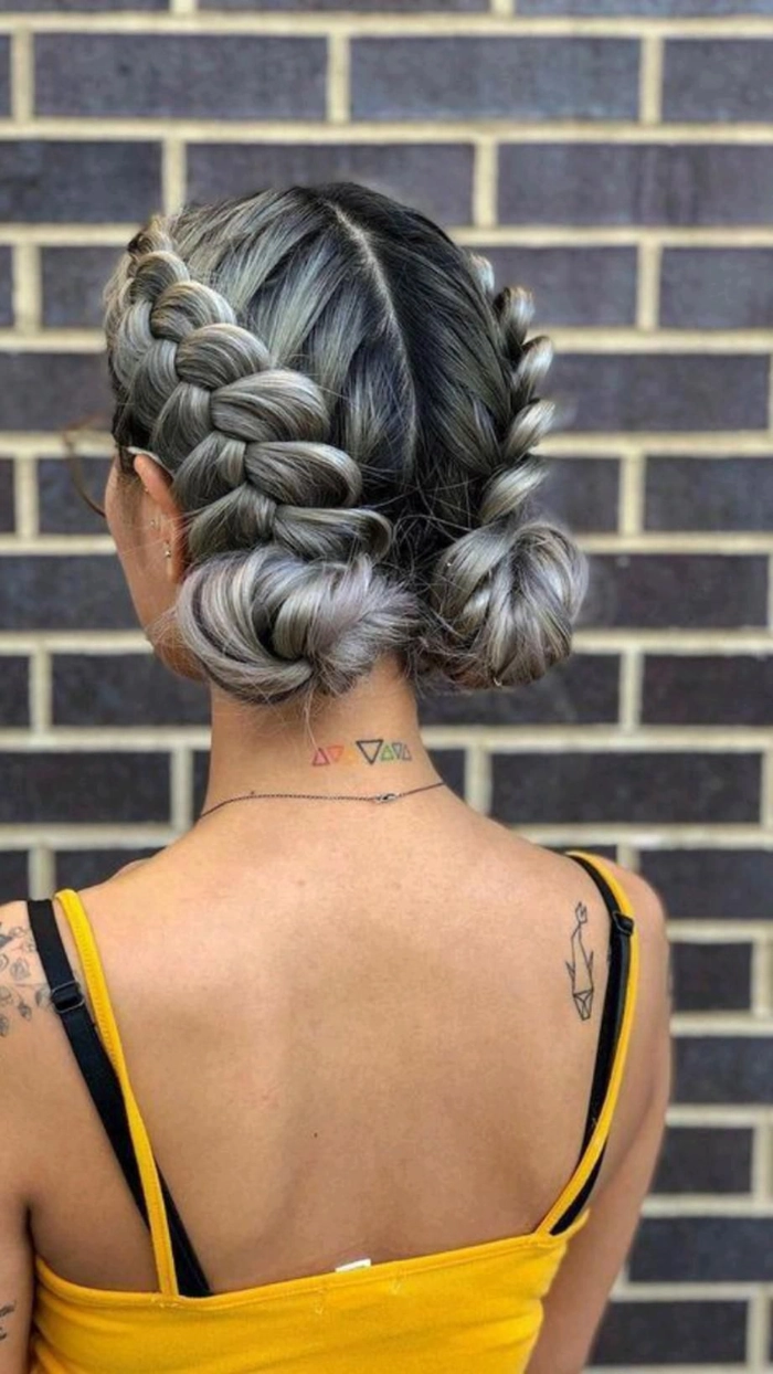 Older woman with elegant curly updo and floral accessory at music festival